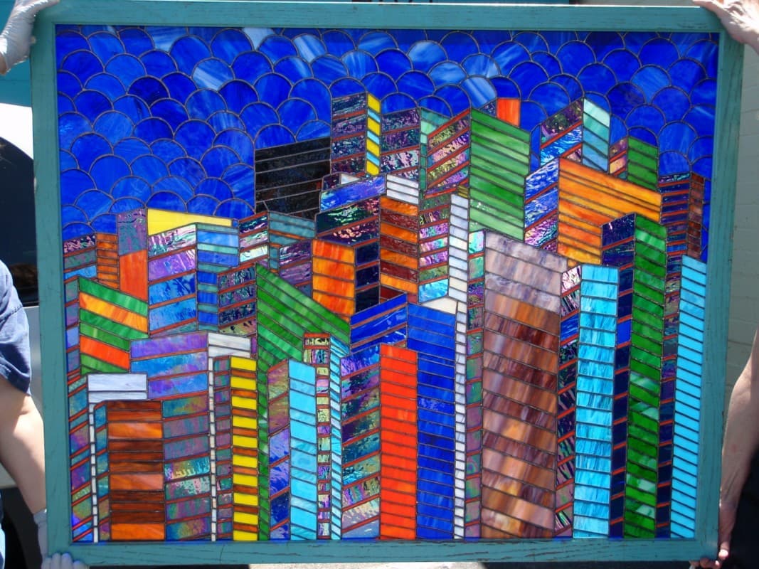 Fully restored stained glass cityscape — all broken pieces replaced