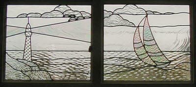 Lighthouse and boat stained glass scene