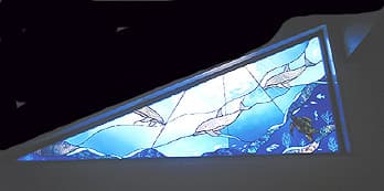 Dolphins stained glass panel — aquatic scene