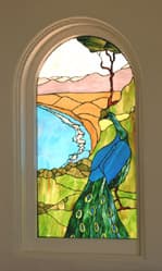 Peacock detail stained glass piece