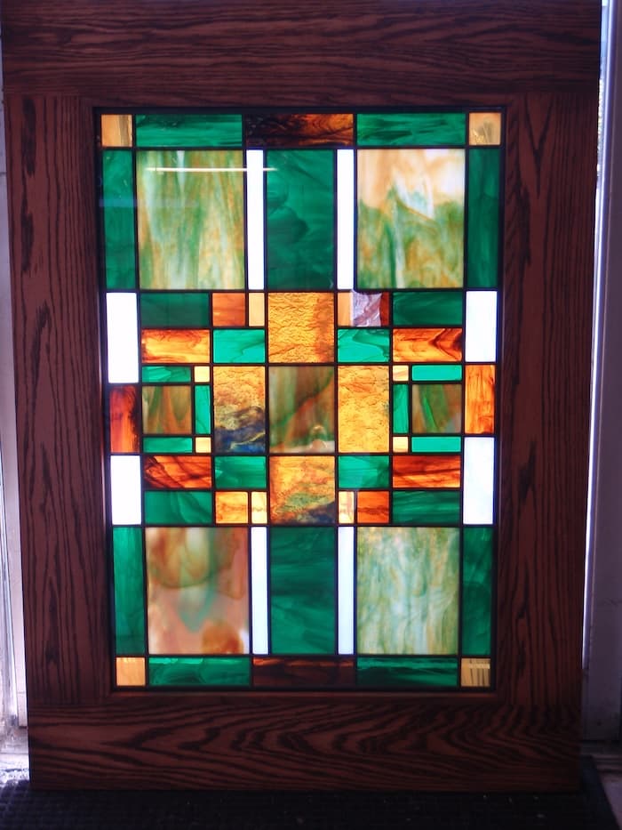 Turquoise and orange patterned stained glass
